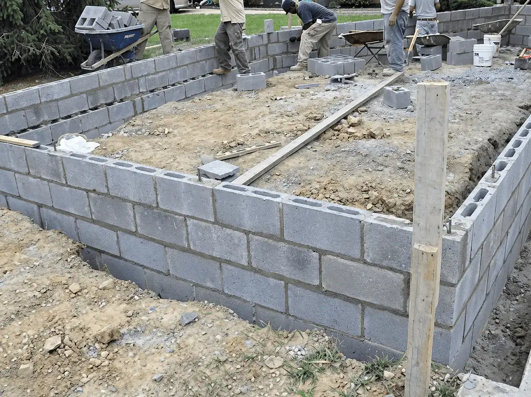 Professionals building a foundation with blocks in Lowell, MA