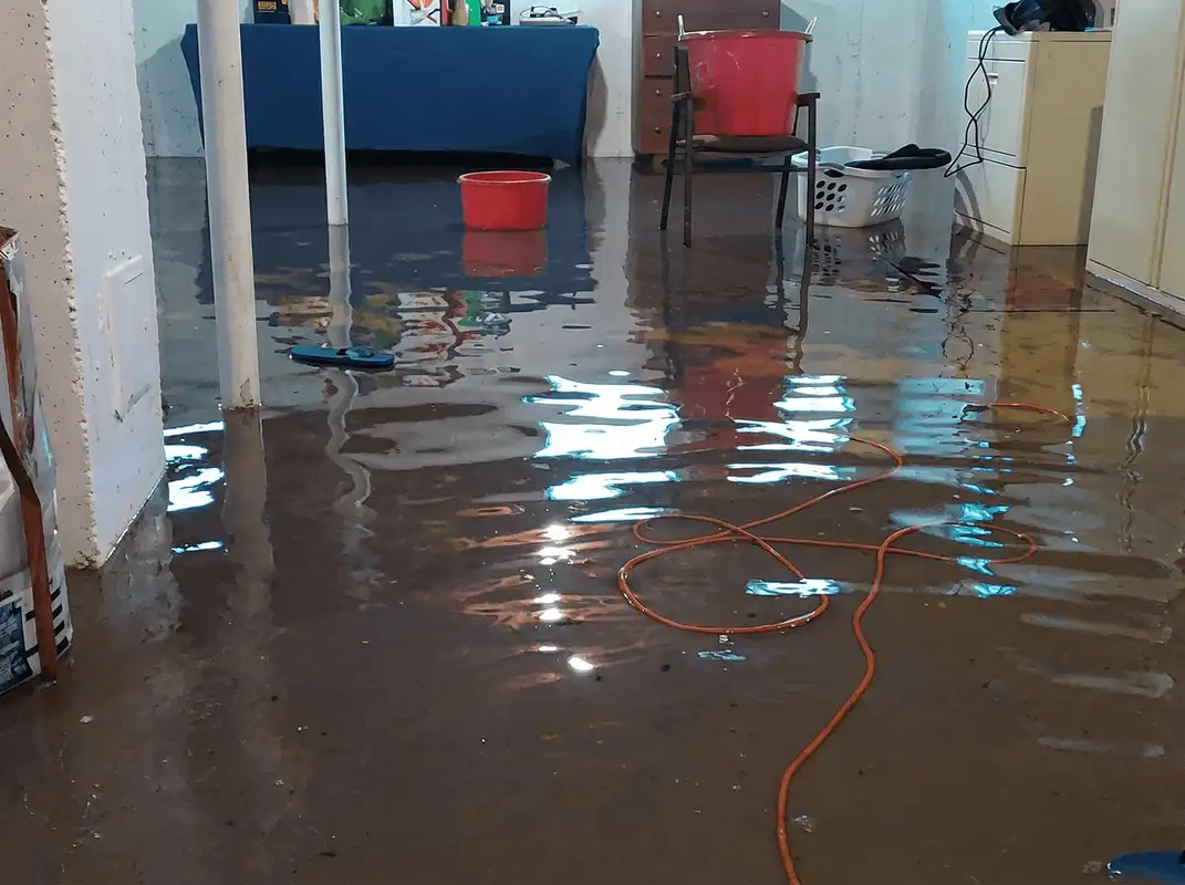 Basement with boiler, cabinets and washing machine completely flooded in Lowell, MA