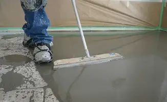 Uneven floor being professionally repaired in Lowell, MA